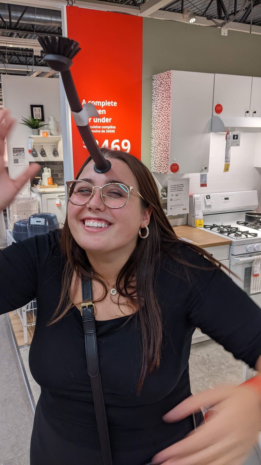 A woman, so beautiful even sunsets cannot match her, with a dish wand stuck to her forehead.